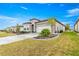 Beautiful front exterior featuring stone accents, a well-manicured lawn and an eye catching driveway at 5728 Sw 90Th Court Rd, Ocala, FL 34481