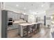 Beautiful gray kitchen featuring a large island with seating at 5728 Sw 90Th Court Rd, Ocala, FL 34481