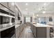 Beautiful gray kitchen featuring a large island and stainless appliances at 5728 Sw 90Th Court Rd, Ocala, FL 34481