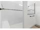 Large walk-in shower with frameless glass, white subway tile, and a built-in bench at 5728 Sw 90Th Court Rd, Ocala, FL 34481