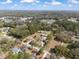 Expansive aerial view showcasing the property nestled among lush greenery and nearby neighborhood at 5995 Se 22Nd Ave, Ocala, FL 34480