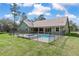 A serene backyard features a swimming pool enclosed by a fence, offering both privacy and safety at 5995 Se 22Nd Ave, Ocala, FL 34480