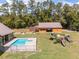 Aerial view of home with pool, playground, and covered porch perfect for outdoor entertaining at 5995 Se 22Nd Ave, Ocala, FL 34480