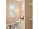 Powder room with custom cabinets, granite countertops, and updated fixtures at 5995 Se 22Nd Ave, Ocala, FL 34480