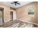 Bedroom featuring hardwood floors, closet and natural light from the window at 5995 Se 22Nd Ave, Ocala, FL 34480