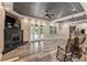 Spacious living room featuring a fireplace, wood-look floors, and a striking wood-paneled ceiling at 5995 Se 22Nd Ave, Ocala, FL 34480