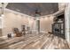 Spacious living room boasting distinctive wood-look flooring and a cozy fireplace feature at 5995 Se 22Nd Ave, Ocala, FL 34480