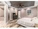 Spacious bedroom featuring a wooden ceiling, ceiling fan, and plank flooring at 5995 Se 22Nd Ave, Ocala, FL 34480