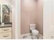 Powder room with toilet and vanity with granite counters at 5995 Se 22Nd Ave, Ocala, FL 34480