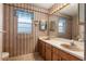 Bathroom featuring double sinks, vintage faucet, and natural light at 711 Se 26Th St, Ocala, FL 34471