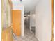 Inviting foyer featuring tile flooring, coat closet, and a clear view of the home's hallway at 711 Se 26Th St, Ocala, FL 34471