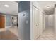 A hallway with storage closets leading into the living room at 711 Se 26Th St, Ocala, FL 34471