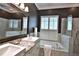 Modern bathroom featuring double vanity, granite countertop, glass enclosed shower, and plantation shutters at 8135 Nw 26Th Lane Rd, Ocala, FL 34482