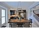 Elegant dining room featuring a modern table and chairs next to the gourmet kitchen at 8135 Nw 26Th Lane Rd, Ocala, FL 34482