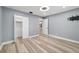 Bedroom features gray walls, hard wood floors and a closet, offering a comfortable and functional living space at 8703 Sw 93Rd Ln # A, Ocala, FL 34481