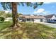 Traditional single-story home featuring a manicured lawn, mature trees, and inviting curb appeal at 8703 Sw 93Rd Ln # A, Ocala, FL 34481