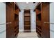 Spacious walk in closet with custom wood shelving and drawers for optimal storage at 8703 Sw 93Rd Ln # A, Ocala, FL 34481