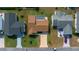 Aerial view with property outline, driveway, landscaping and nearby neighborhood at 912 Chula Ct, Lady Lake, FL 32159