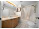 Bright bathroom with a sink, vanity, toilet, shower and bath-tub at 912 Chula Ct, Lady Lake, FL 32159