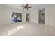 Large bedroom featuring tile flooring, a ceiling fan, and natural light at 912 Chula Ct, Lady Lake, FL 32159