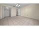 Bedroom featuring tile flooring and a closet with sliding doors at 912 Chula Ct, Lady Lake, FL 32159