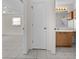 Hallway view of the bathroom and bedroom featuring tile floors throughout at 912 Chula Ct, Lady Lake, FL 32159