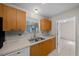 Functional kitchen equipped with classic wood cabinets and a stainless steel sink at 912 Chula Ct, Lady Lake, FL 32159