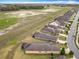 Aerial view of a residential community with beautiful homes near a sprawling field at 9697 Sw 63Rd Loop, Ocala, FL 34481