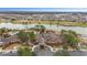 Overhead shot of a community clubhouse and pool with a large lake, golf course and surrounding homes at 9697 Sw 63Rd Loop, Ocala, FL 34481