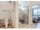 Beautiful bathroom featuring a glass enclosed shower with a bench and neutral tiling at 9697 Sw 63Rd Loop, Ocala, FL 34481