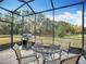 Enjoy grilling on the lanai while enjoying the lush greenery and beautiful scenery at 9697 Sw 63Rd Loop, Ocala, FL 34481