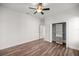 Bedroom with hardwood floors, ceiling fan and closet at 10138 Lake Miona Way, Oxford, FL 34484