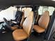 Interior car view showing front and back seats with brown leather upholstery at 10138 Lake Miona Way, Oxford, FL 34484
