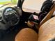 Car interior view showing front seats with brown leather upholstery and seat at 10138 Lake Miona Way, Oxford, FL 34484