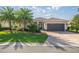 Charming single story home with beautiful landscaping, paver driveway and spacious two car garage at 10138 Lake Miona Way, Oxford, FL 34484