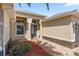 Inviting front entryway showcasing brick pavers, stone accents, and a transom window above the front door at 10138 Lake Miona Way, Oxford, FL 34484