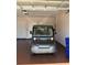 View of the garage showing a small electric vehicle parked inside at 10138 Lake Miona Way, Oxford, FL 34484