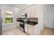 Updated kitchen featuring stainless steel appliances, granite countertops, and stylish tile backsplash at 10138 Lake Miona Way, Oxford, FL 34484