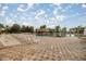Resort-style pool with a rock waterfall feature and comfortable lounge chairs, perfect for relaxation and leisure at 10138 Lake Miona Way, Oxford, FL 34484