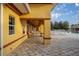 Inviting poolside lounge area with travertine tile and comfortable seating, perfect for relaxation and leisure at 10138 Lake Miona Way, Oxford, FL 34484