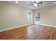 Bedroom with wood-look floors, neutral walls, recessed lighting, and large window at 10215 Sw 134Th Ct, Dunnellon, FL 34432