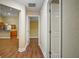 Hallway features modern lighting, neutral tones, and seamless access to the kitchen and other areas of the home at 10215 Sw 134Th Ct, Dunnellon, FL 34432