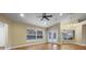 Bright living room with wood floors and a view of the outdoor pool at 10215 Sw 134Th Ct, Dunnellon, FL 34432