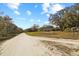 Long driveway leading up to home, showcasing the acreage and privacy at 10215 Sw 134Th Ct, Dunnellon, FL 34432