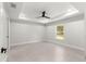 Minimalist bedroom with tiled floors, ceiling fan, recessed lighting, and a view to the yard through the window at 10657 Sw 110Th Ct, Dunnellon, FL 34432