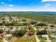 Aerial view of a home in a tranquil neighborhood, surrounded by mature trees and a sense of community at 11620 Sw 84Th Avenue Rd, Ocala, FL 34481