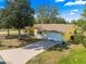 Aerial view showcasing this single-Gathering home's expansive driveway and beautiful landscaping at 11620 Sw 84Th Avenue Rd, Ocala, FL 34481