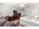 Main bedroom offering desk and chair, ceiling fan, and dresser at 11620 Sw 84Th Avenue Rd, Ocala, FL 34481