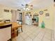 Inviting dining area featuring tile flooring, functional appliances, and space for a cozy dining experience at 13521 N Magnolia Ave, Citra, FL 32113