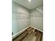 Walk-in closet space with wood-look flooring and wire shelving for organized storage and convenience at 13936 Sw 113 Ln, Dunnellon, FL 34432